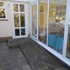 Backdoor to kitchen with ramp