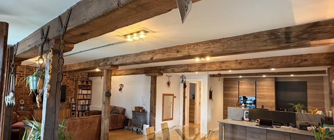 View across dining area to principal desk and kitchen