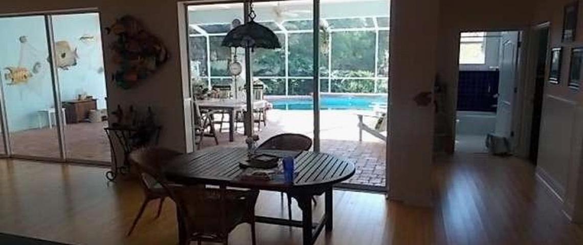 kitchen open to dinette area and lanai/pool.  Home is fully flat no transitions.
